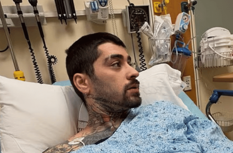 Zayn Malik in hospital bed with a concerned expression, surrounded by medical equipment, highlighting the importance of seeking medical help when needed, with a focus on cardiologist expertise