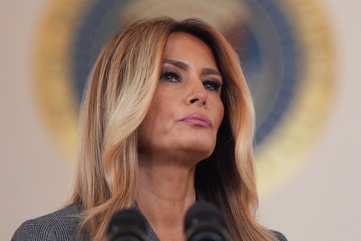 Melania Trump speaking at a public event, with a serious expression, surrounded by controversy and scandal, regarding her statement on Epstein