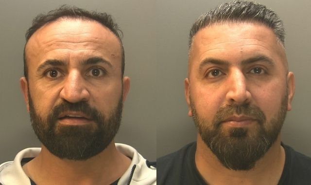 A group of people being smuggled into Europe, with a car wash in the background, highlighting the link between the car wash industry and human trafficking, with a focus on the primary keyword human trafficking