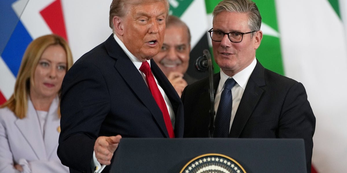 Aerial view of the Strait of Hormuz, with oil tankers and ships passing through the critical waterway, highlighting the importance of the region for global oil supplies and the potential risks of the US-led blockade