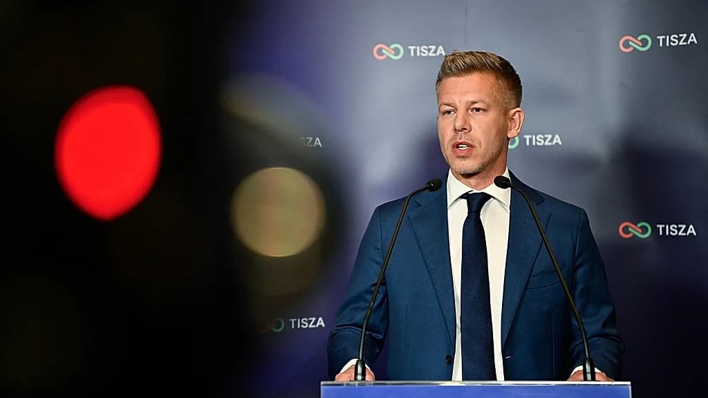 Péter Magyar speaking to reporters about Tisza's election strategy, with a determined look on his face, surrounded by supporters, highlighting the importance of winning elections and connecting with voters on key issues