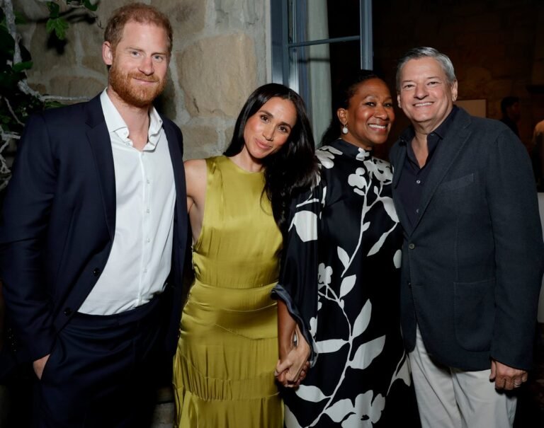Meghan Markle attending an event with Netflix boss and his wife, smiling and looking confident, her fashion sense on point, amidst the news of her show cancellation, with a mix of colours and patterns in the background