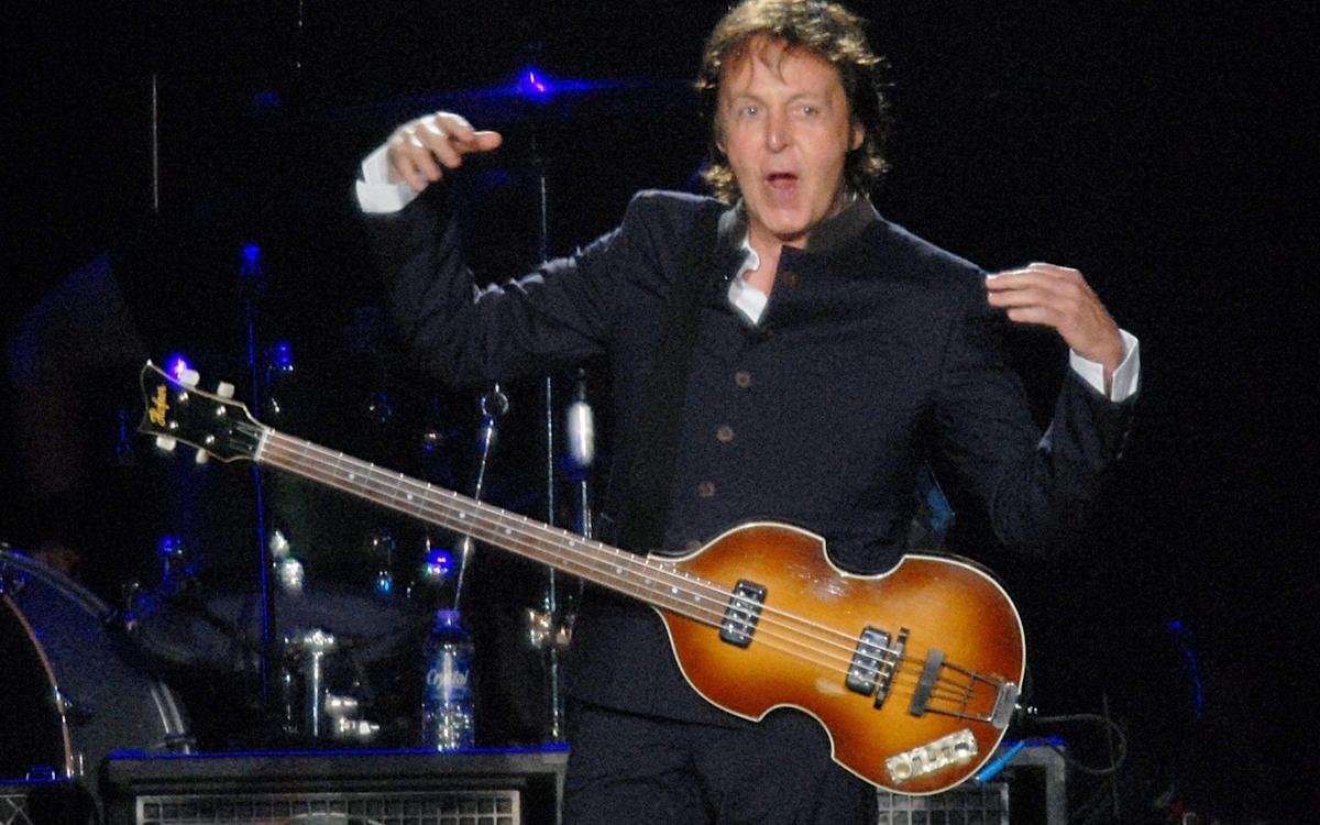 Paul McCartney with bass guitar maker