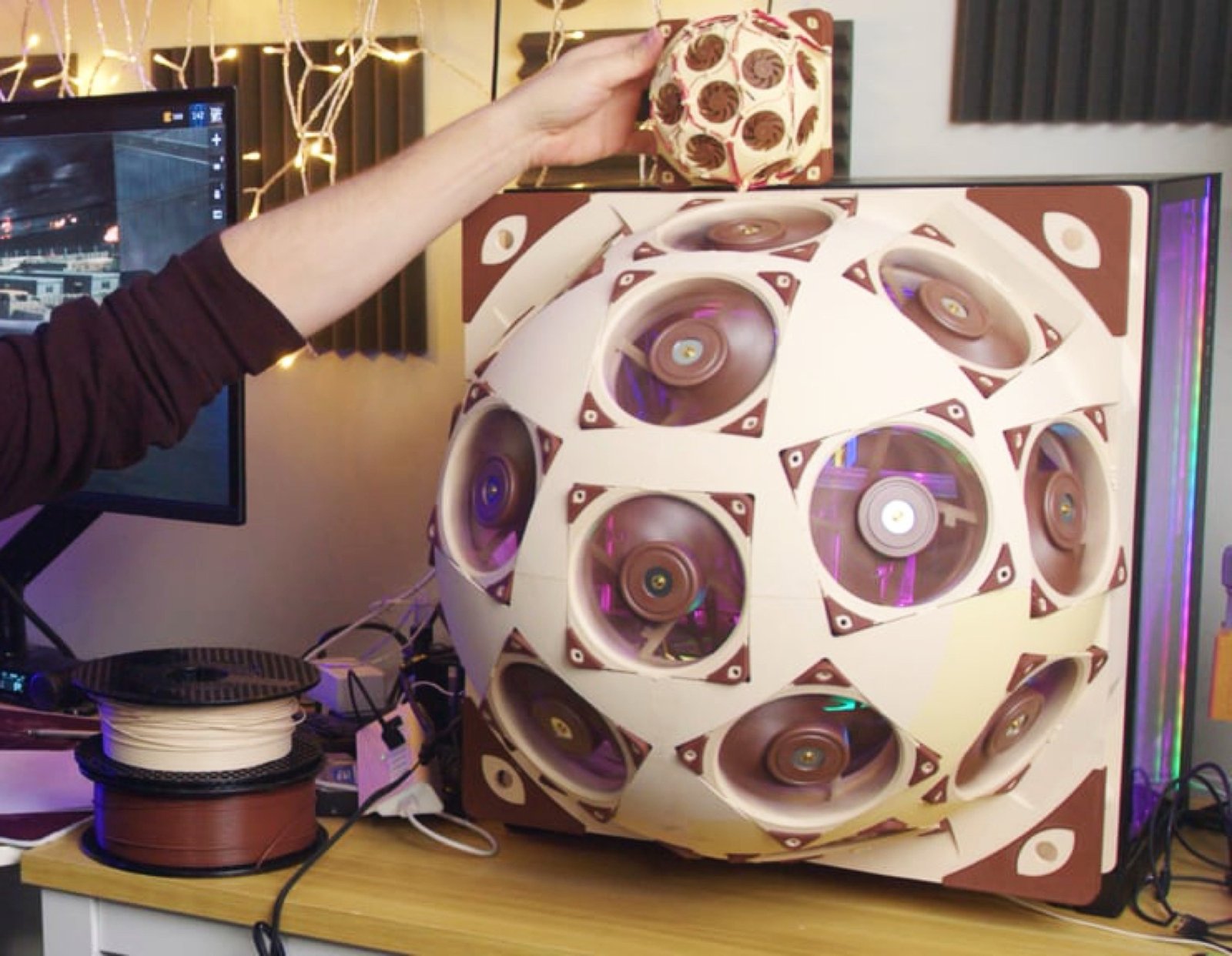 The Noctua SuperDome features a unique hemispherical side panel housing 15 high-quality 120mm fans, designed to cool powerful gaming hardware effectively and reduce noise levels, perfect for the UK gaming community