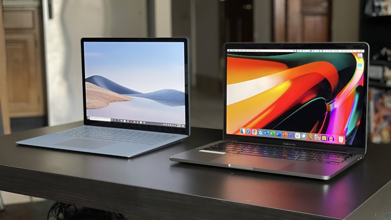 A side-by-side comparison of Apple's MacBook and Microsoft's Surface Laptop, highlighting the price difference and features of each device, with a focus on the UK market and the primary keyword phrase 'MacBook Price Advantage'