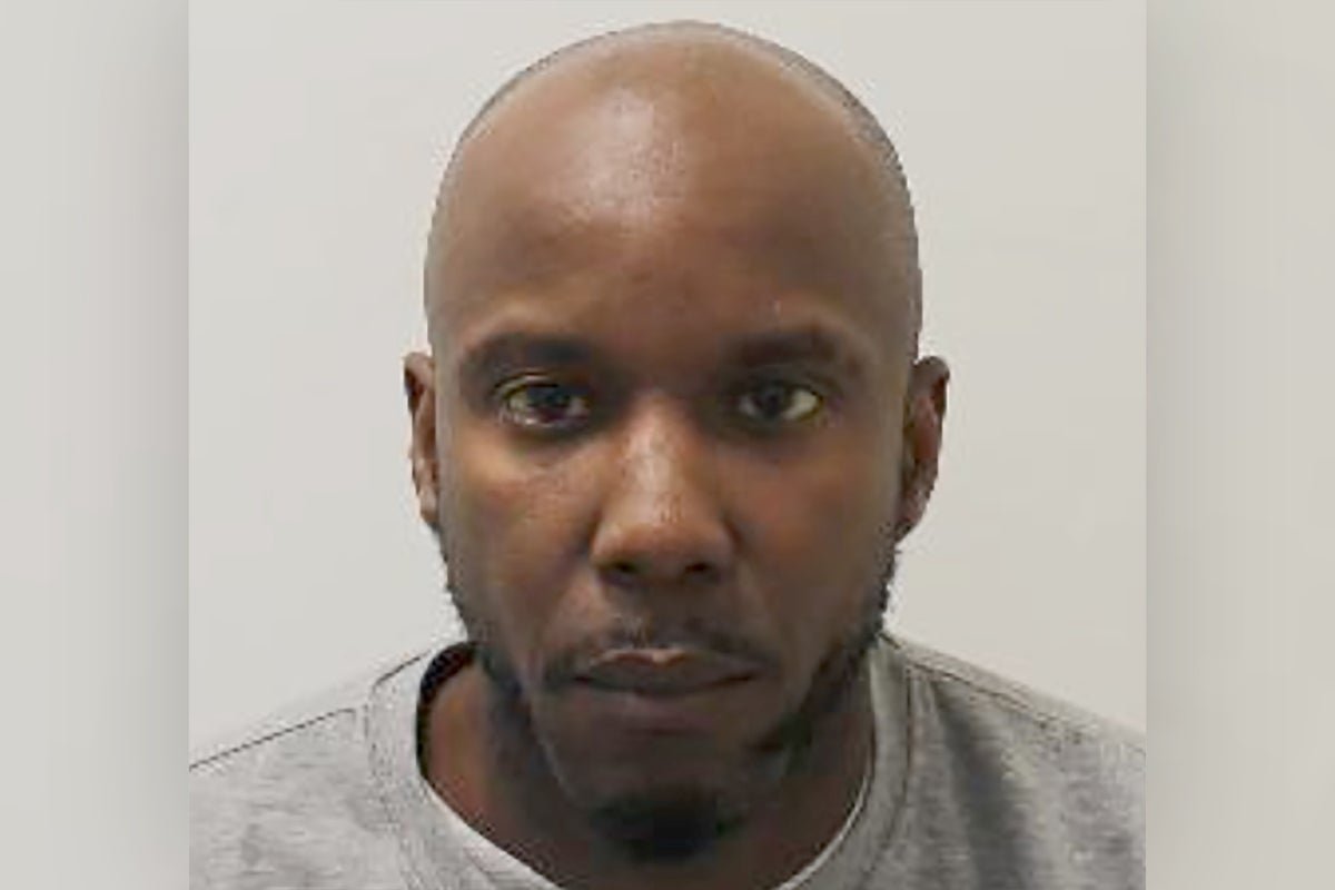 A photo of a person holding a sign that reads 'Justice for the Deaf Woman' with a crowd of people in the background, all of whom are holding similar signs and looking determined, with a focus on disability awareness and inclusivity