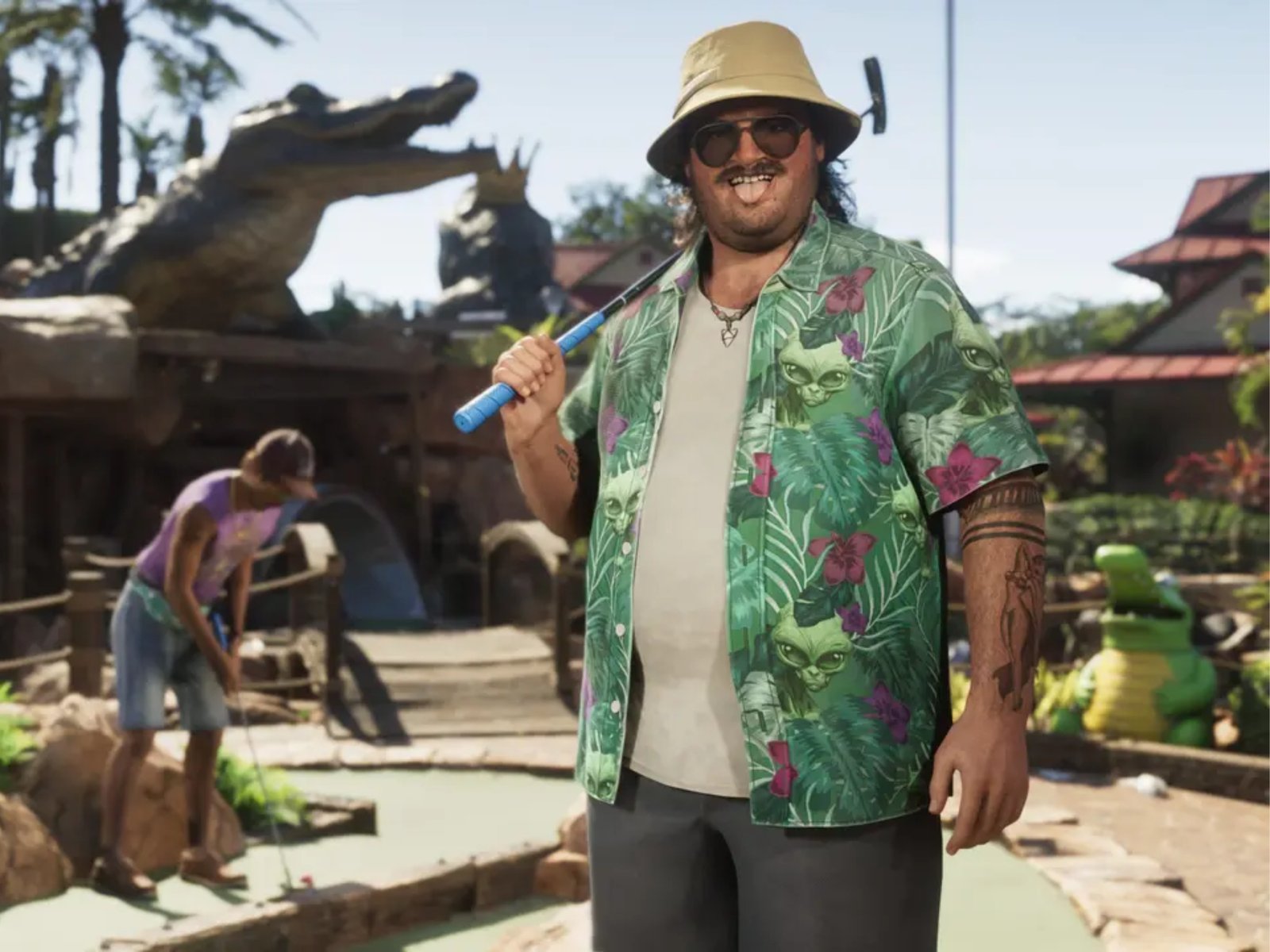 A person sitting in front of a computer with a worried expression, symbolising the concern surrounding the cyberattack on Rockstar Games in the UK, with a cityscape in the background and a faint image of a Grand Theft Auto VI logo