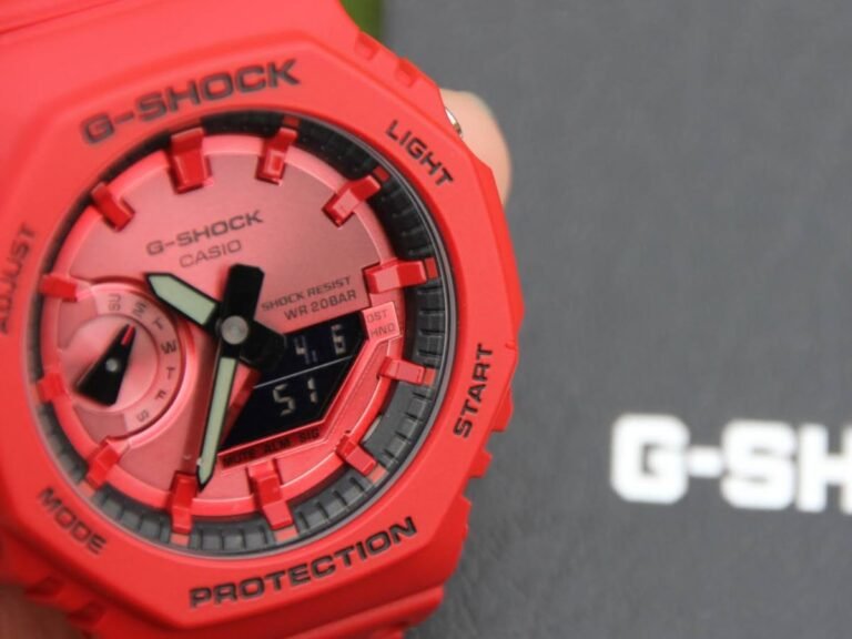 The limited edition Casio G-Shock GA-2100 series watch features a bright red design with a dark background display, perfect for watch collectors and football fans in the UK, with a unique collaboration between Casio and Kochi United Sports Club