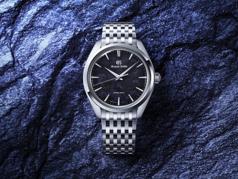 The Grand Seiko Elegance Collection Hand-winding Spring Drive SBGY043 watch, featuring a stunning dark blue dial and sleek silver tone metal casing, with a slim movement and engraved dial, perfect for luxury watch enthusiasts in the UK