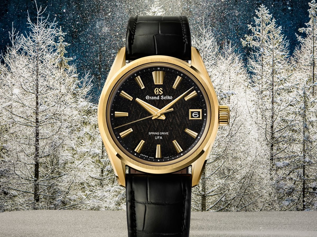 The Grand Seiko Evolution 9 Spring Drive U.F.A. SLGB006 watch, featuring a gold casing and black leather strap, with a gold flecked watch face, a true masterpiece of horology, available in the UK, with its unique blend of style and functionality, this luxury watch is sure to turn heads, with its sleek design and elegant colour scheme, making it a versatile accessory for any occasion