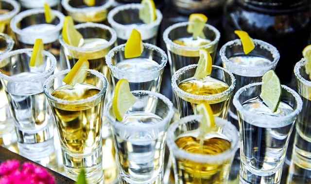 A photo of a cruise ship with a warning sign about responsible drinking, highlighting the dangers of excessive alcohol consumption with a primary keyword of Carnival cruise tequila incident