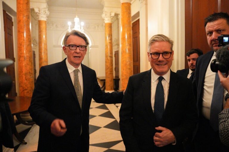Lord Lammy and Lord Mandelson in a meeting, with a caption describing the vetting scandal and the importance of transparency in government, with primary keyword 'vetting scandal' naturally included
