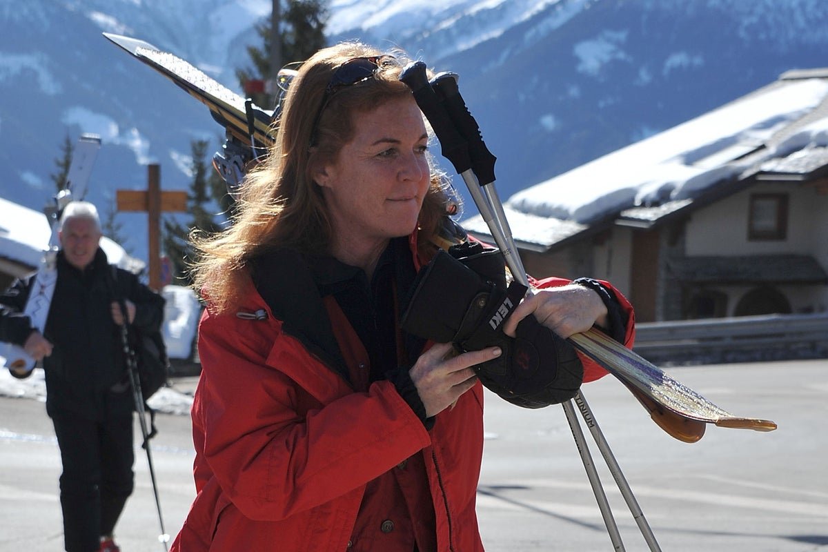 A photograph of Sarah Ferguson, the Duchess of York, with her daughters Beatrice and Eugenie, highlighting the strong bond between them and the potential impact of media scrutiny on their behaviour and wellbeing, with a subtle background colour that reflects the complexity of the situation