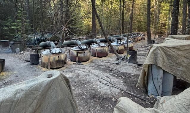 A US drone flying over the Mexican border, with a cityscape in the background, highlighting the complex issue of US involvement in Mexico's drug war and the need for international cooperation to combat organised crime