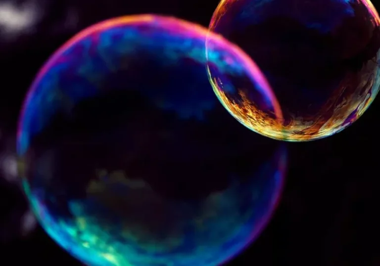 Satya Nadella speaking at the World Economic Forum in Davos, discussing the importance of mainstream AI adoption to avoid a speculative bubble, with a focus on artificial intelligence and its potential impact on society