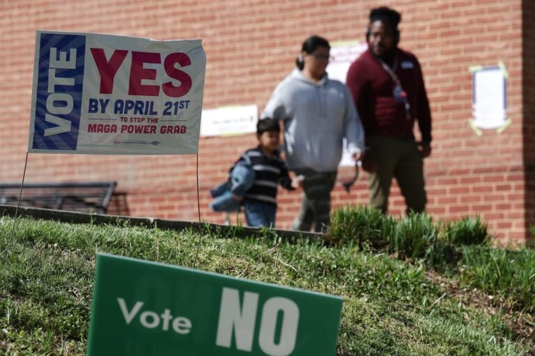 Donald Trump speaking at a rally, with a crowd of supporters in the background, as he launches a scathing attack on the Virginia redistricting outcome, claiming it was a 'RIGGED ELECTION'