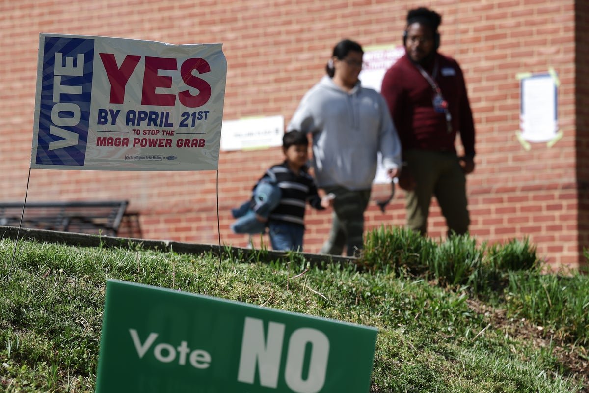 Donald Trump speaking at a rally, with a crowd of supporters in the background, as he launches a scathing attack on the Virginia redistricting outcome, claiming it was a 'RIGGED ELECTION'