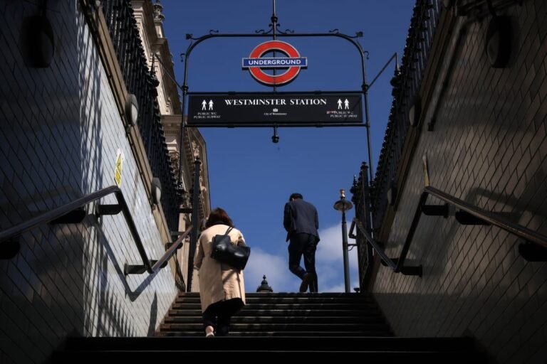 A busy London street with people walking and cycling, despite the Tube strikes, with a focus on the impact of RMT walkouts on commuter behaviour and the London transport network