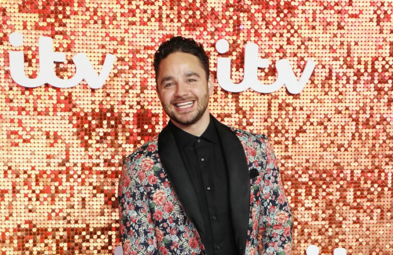 Adam Thomas crowned King of the Jungle in I’m a Celebrity…Get Me Out of Here! All Stars, with a huge smile on his face and the jungle setting in the background, showcasing the colour and excitement of the competition