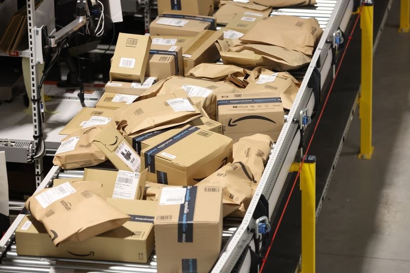 A cleaner in a warehouse, with a juice carton in the background, highlighting the incident that led to their dismissal, with a focus on Amazon warehouse policies