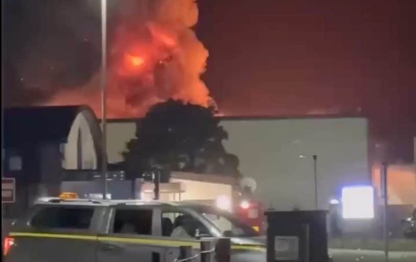 A massive fire engulfs a US air base used to strike Iran, with thick black smoke billowing into the air, as firefighters work to bring the blaze under control, highlighting the primary keyword of US air base