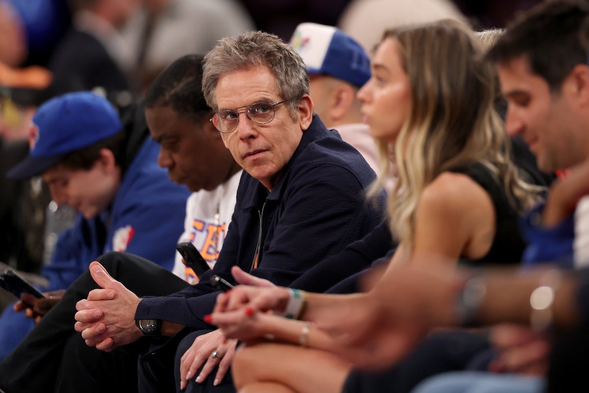 Ben Stiller looking surprised and shocked at a press conference, with a caption that reads 'Ben Stiller faces controversy over misinterpreted tweet', the primary keyword being 'Ben Stiller controversy'