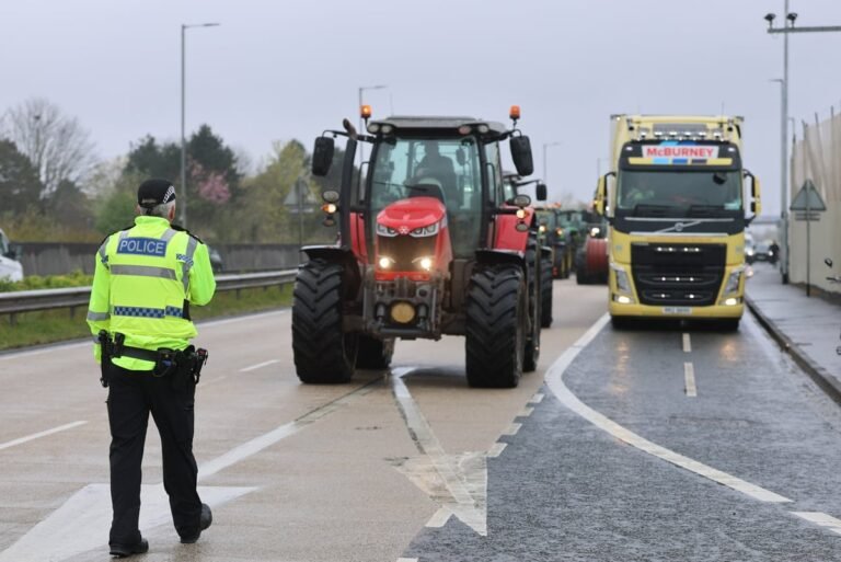Fuel protesters gather in London for a major national demonstration, holding signs and banners calling for lower fuel prices and reduced fuel taxes, with a focus on sustainable energy solutions and a reduction in carbon emissions