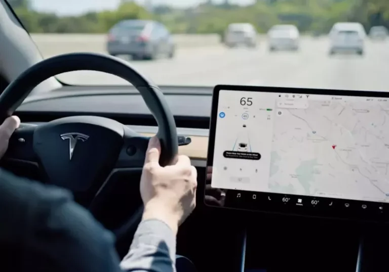 A Tesla vehicle on the road, showcasing its Autopilot system in action, with a focus on the primary keyword, driver-assistance systems, and the company's commitment to innovation and customer experience, highlighting the colour and complexity of the automotive landscape