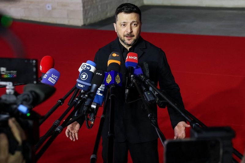 A ship loaded with grain sails through the Black Sea, with the Ukrainian and Russian flags visible in the background, highlighting the complex and contentious issue of grain trade between the two nations, with the primary keyword being grain trade
