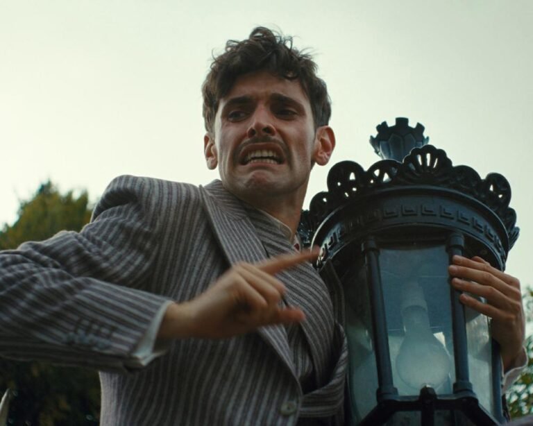 A body is found in a surrealist period drama, with a dreamlike quality and a unique blend of colour and lighting, setting the tone for a captivating and thought-provoking viewing experience, with a focus on surrealist period drama