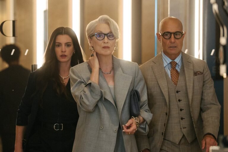 The Devil Wears Prada 2 movie poster featuring the lead characters in a fashionable setting, with a mix of bright colours and elegant attire, showcasing the film's themes of fashion and behaviour