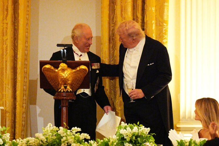 King Charles and Trump in a diplomatic meeting, discussing nuclear weapons and Iran's nuclear programme, with a focus on finding a peaceful resolution to the diplomatic row