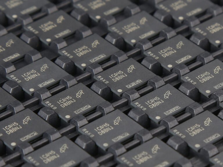 A close-up of a memory chip with a cityscape in the background, representing the growing demand for AI-related components in the UK, with a focus on memory manufacturers and their role in the tech industry