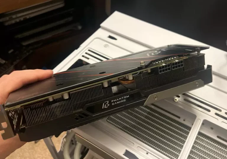 A photo of the Asrock Phantom Gaming Radeon RX 5700 XT graphics card, still in its original retail box, with a price tag of $5. The AMD RX 5700 XT is a powerful graphics card, renowned for its exceptional performance and features, making it a highly sought-after component among gamers and tech enthusiasts.