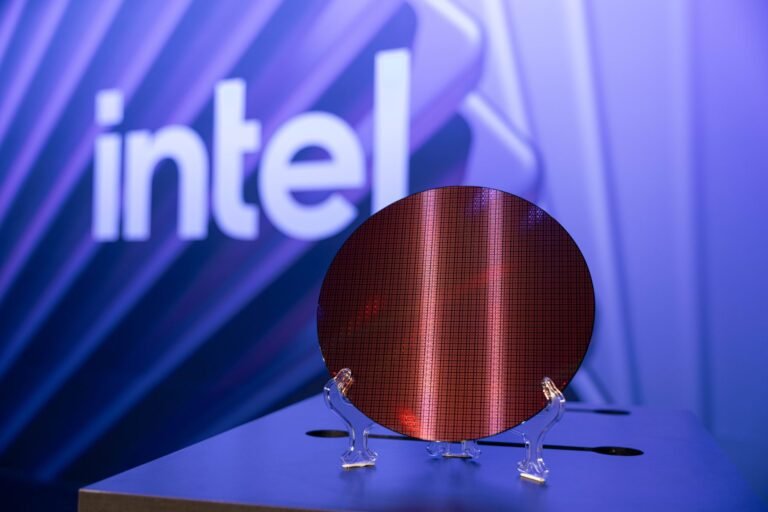 Intel's 18A-P process technology wafer, showcasing the company's latest innovation in semiconductor manufacturing, with improved thermal conductivity and tighter skew corners, set to attract UK foundry customers and drive growth in the tech sector