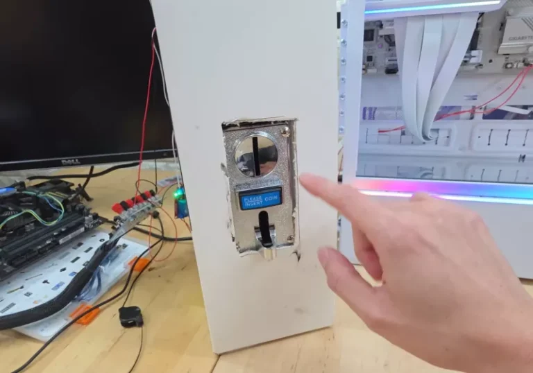 A photo of a coin-operated gaming PC, with a coin slot and a gaming keyboard and mouse. The PC is powered by a microtransaction mechanism, allowing users to pay for gaming time using coins or tokens. This innovative concept is set to change the gaming industry, with its unique blend of technology and gameplay. The coin-operated gaming PC is a game-changer, and it's an idea that's worth exploring further.