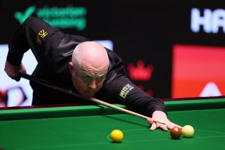 John Higgins in action, demonstrating his exceptional snooker skills and strategic thinking, with a focused expression, surrounded by a crowd of spectators