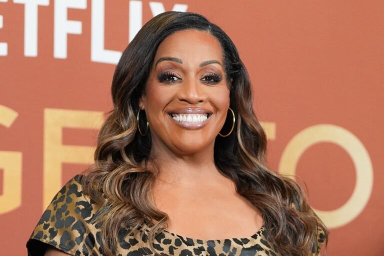Alison Hammond smiling and holding a microphone, with a colourful background and a gameshow logo, ready to host the classic ITV gameshow
