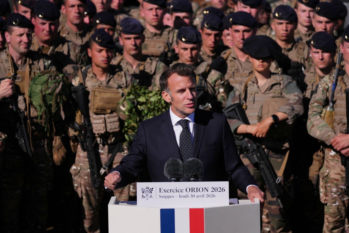 French President Emmanuel Macron responding to King Charles' comment about speaking French, with a witty and clever remark that has garnered significant attention and praise for its humour and diplomacy