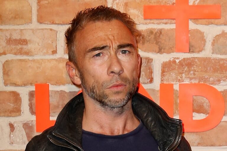 A photo of Julian Dunkerton, Superdry co-founder, with a caption describing the conviction and its impact on the fashion brand, including the potential colour and branding changes