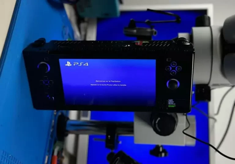 A DIY PlayStation handheld device featuring a 7-inch 1080p OLED display, built using a PS4 Slim motherboard, showcasing its compact design and vibrant colour display, with a 16:9 aspect ratio, perfect for playing PS4 titles on the go.