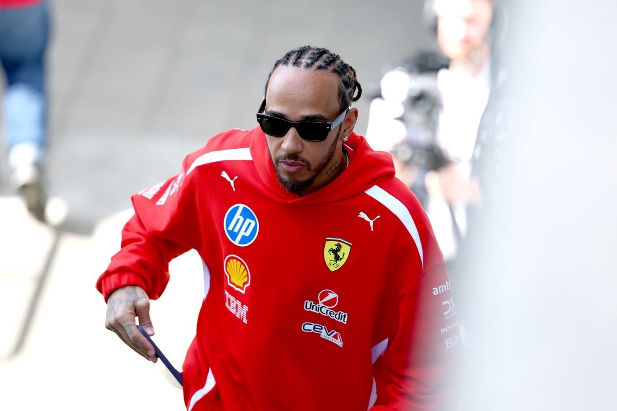 The Miami GP starting grid, featuring top F1 drivers and their sleek cars, poised and ready to take on the challenging circuit, with the colourful Miami atmosphere providing a vibrant backdrop to the action