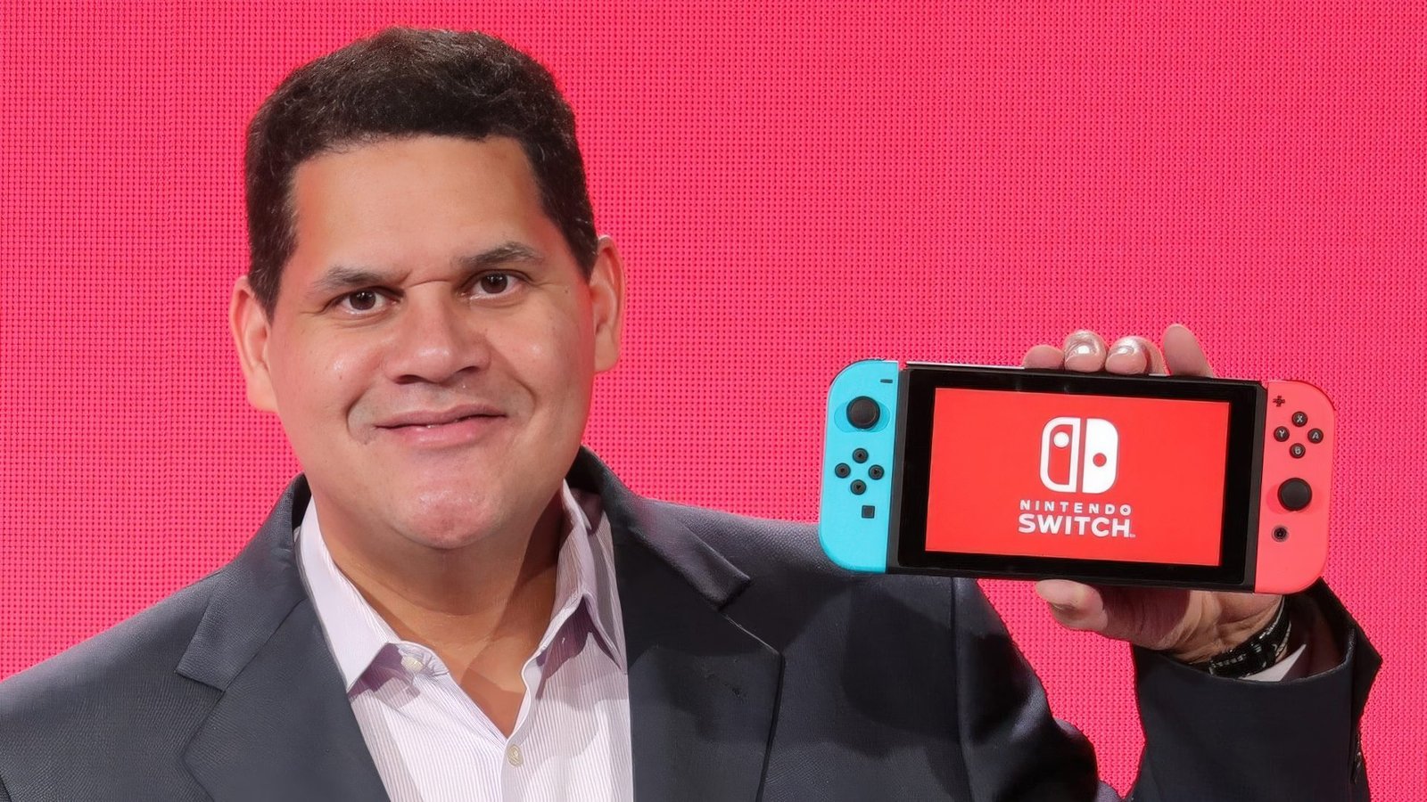 Reggie Fils-Aimé, former Nintendo of America president, discussing the company's unique pricing policy, which reflects its Kyoto roots and commitment to quality, with a focus on the UK gaming market and Nintendo's approach to game pricing