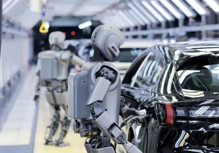 A humanoid robot working on a factory floor, surrounded by machines and conveyor belts, with a caption that reads 'humanoid robots in factory settings'