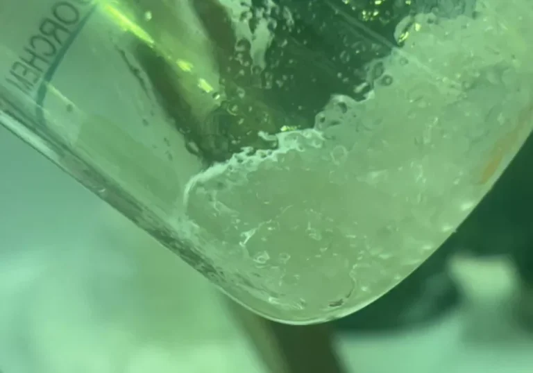 A close-up of the innovative copper-aluminum filter, with a background image of a polluted water source, highlighting the primary keyword forever chemicals and the potential of this technology to restore environmental health