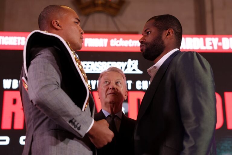 Wardley and Dubois face off in the ring, surrounded by a crowd of cheering fans, with a banner reading Wardley vs Dubois in the background, showcasing the excitement and colour of the event
