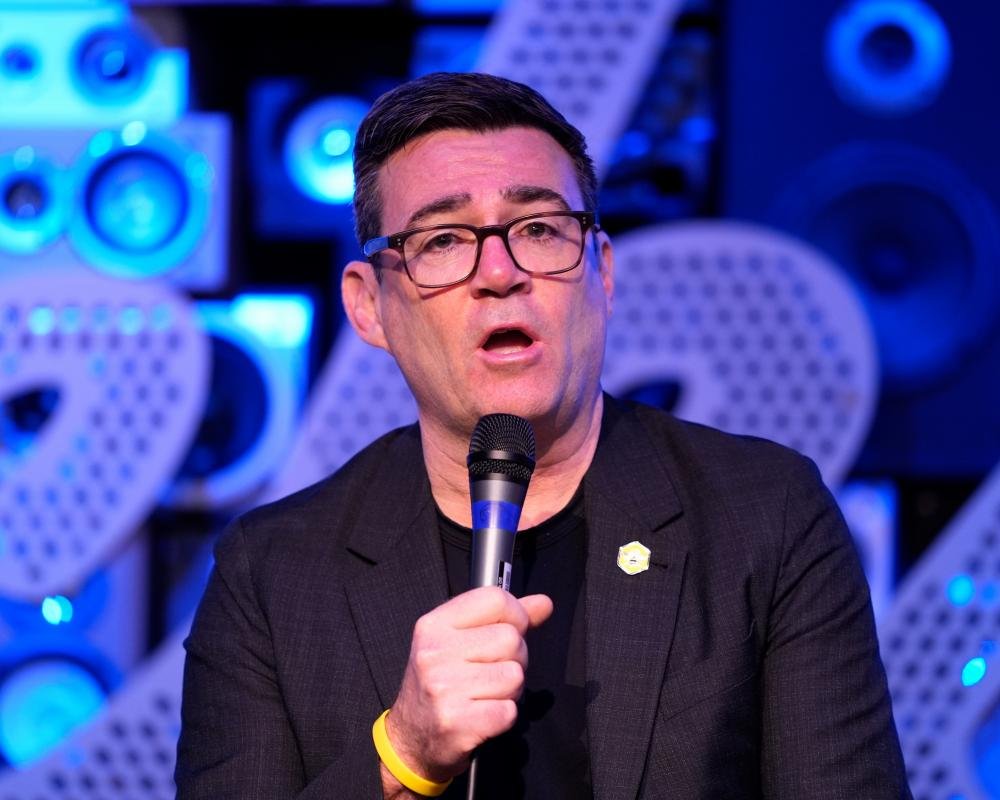 Andy Burnham stands alongside Green Party members, sparking controversy and debate about Labour's environmental credentials and party loyalty