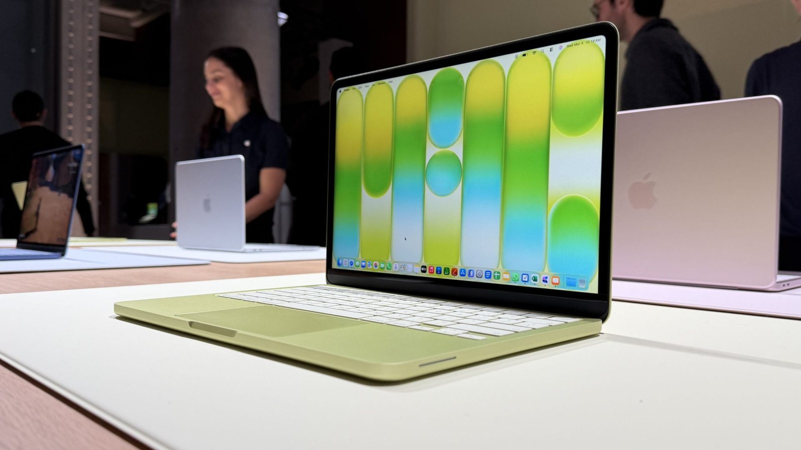 A person using a Windows 11 laptop in a coffee shop, with a MacBook Neo in the background, highlighting the primary keyword phrase Windows 11 laptops, with a focus on the UK market and the Signal65 report
