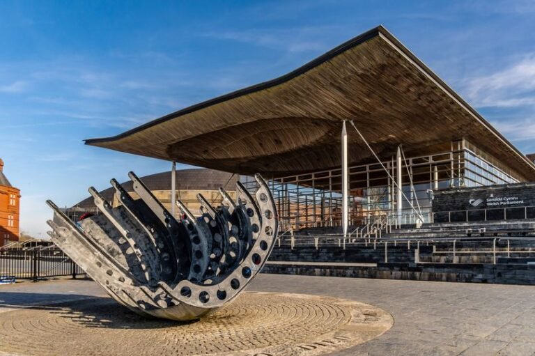 A photograph of a polling station in Wales, with voters casting their ballots in the Senedd Election 2026, highlighting the democratic process and the importance of voting behaviour in shaping the country's future