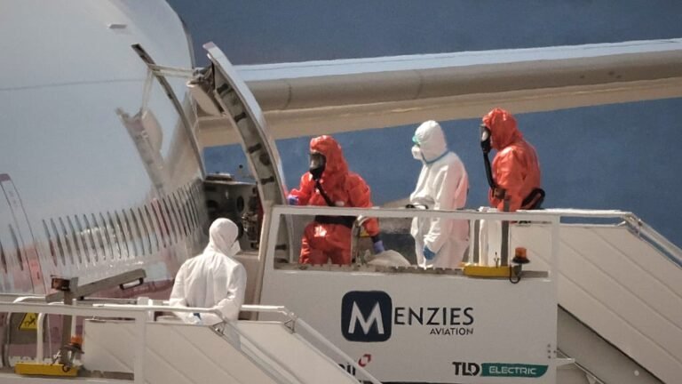 A picture of a ship in Tenerife with a red warning sign, indicating the risk of Hantavirus, a potentially deadly virus that can cause severe respiratory and kidney problems, with a focus on the primary keyword Hantavirus